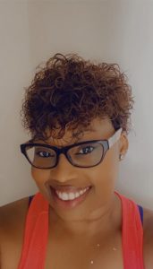 Headshot of Jamie Alexis: a black woman wearing black glasses and a bright red tank top. 